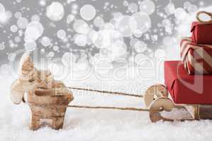 Reindeer With Sled, Silver Stars And Bokeh Background, Copy Space