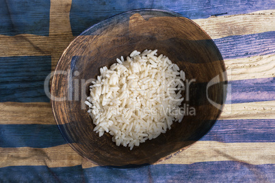 Poverty concept, bowl of rice with Greek flag