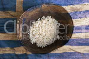 Poverty concept, bowl of rice with Greek flag