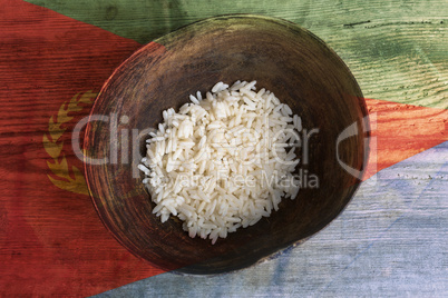 Poverty concept, bowl of rice with Eritrea flag