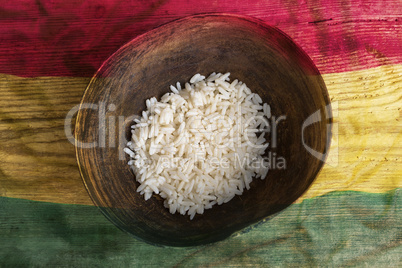 Poverty concept, bowl of rice with Ghana flag