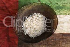 Poverty concept, bowl of rice with United Arab Emirates flag