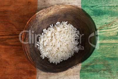 Poverty concept, bowl of rice with Ivory Coast flag