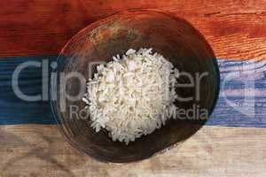 Poverty concept, bowl of rice with Serbian flag