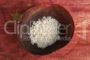 Poverty concept, bowl of rice with Chinese flag