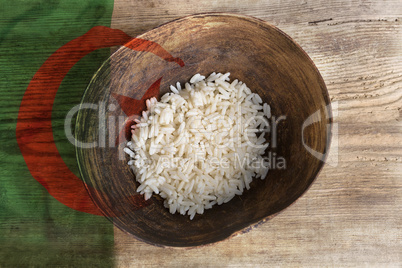 Poverty concept, bowl of rice with Algeria flag