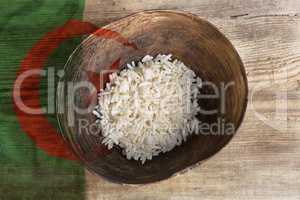 Poverty concept, bowl of rice with Algeria flag