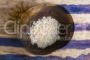 Poverty concept, bowl of rice with Uruguayan flag