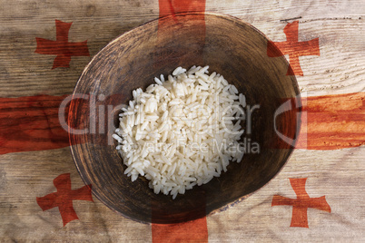 Poverty concept, bowl of rice with Georgia flag