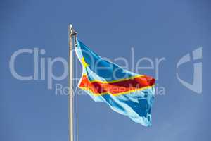 National flag of Congo on a flagpole