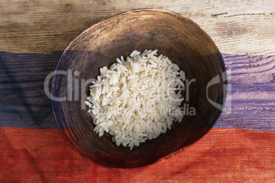 Poverty concept, bowl of rice with Russian flag