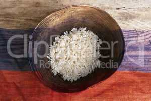 Poverty concept, bowl of rice with Russian flag