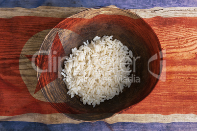 Poverty concept, bowl of rice with North Korea flag