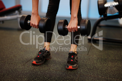 Woman at the fitness gym exercising