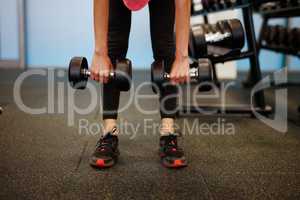 Woman at the fitness gym exercising