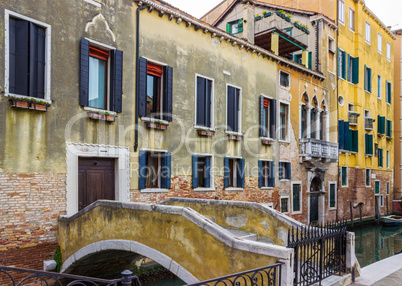 Bridge leading to the house across canal in Venice, Italy.