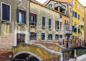 Bridge leading to the house across canal in Venice, Italy.