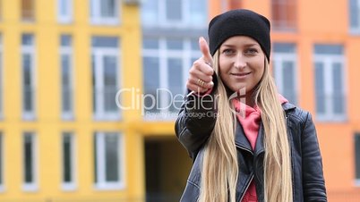 Charming smiling woman catching keys to new house