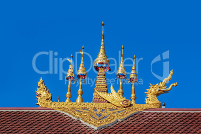 Thailand gold color sculpture on the temple roof