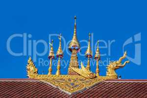 Thailand gold color sculpture on the temple roof
