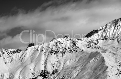 Black and white winter snow mountains at nice sunny day