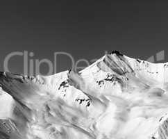 Black and white off-piste snowy slope in winter mountain