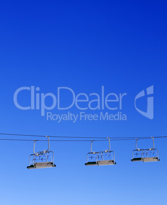 Ski-lift and blue clear sky