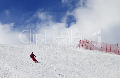Skier on ski slope at nice sun day