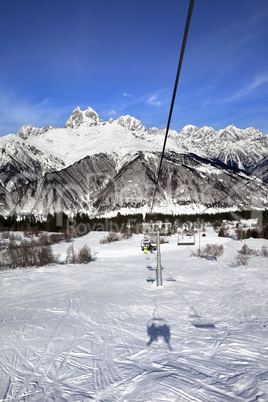 Chair-lift and Mount Ushba in sun day
