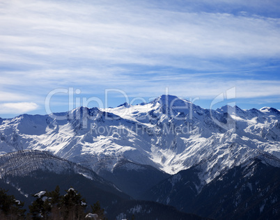 Sunlight snowy mountains and cloudy sky