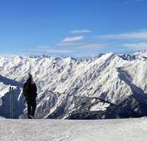 Women on ski slope in winter snow mountain at sun day