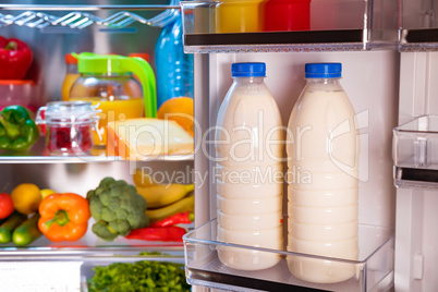 Open refrigerator filled with food