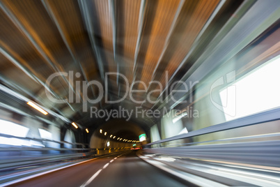 Motion Blur Driving Car at Speed Through a Tunnel