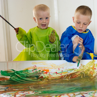 Children painting with their hands