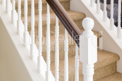 Abstract of Stair Railing and Carpeted Steps in House