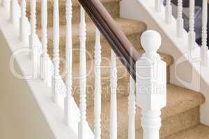 Abstract of Stair Railing and Carpeted Steps in House