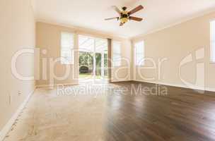 Room with Gradation from Cement to Hardwood Flooring