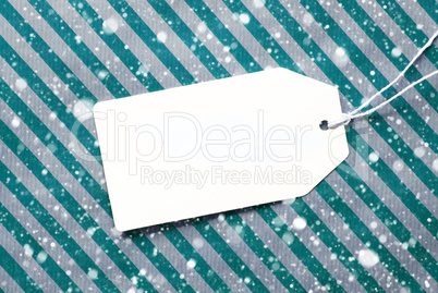 Label On Turquoise Wrapping Paper And Copy Space, Snowflakes