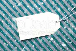 Label On Turquoise Wrapping Paper And Copy Space, Snowflakes