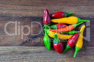Heap of hot red, green and yellow chili peppers
