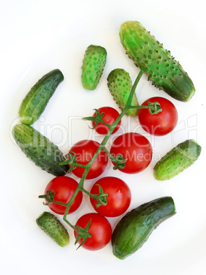 tomatoes and cucumbers isolated on the white