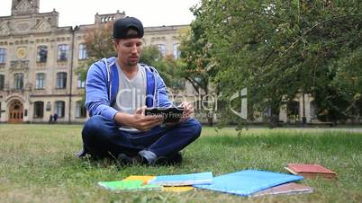 Trendy young student e-learning using tablet