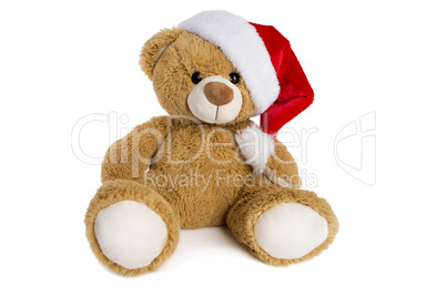 Teddy bear with Santa Claus hat isolated on white background