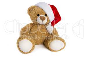 Teddy bear with Santa Claus hat isolated on white background