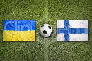 Ukraine vs. Finland flags on soccer field