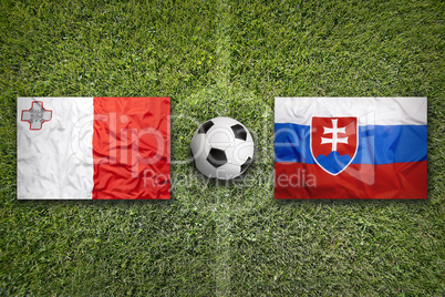 Malta vs. Slovakia flags on soccer field