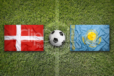 Denmark vs. Kazakhstan flags on soccer field