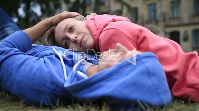 Woman lying on the chest of her beloved outdoors