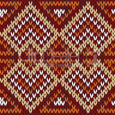 Ethnic knitting seamless pattern in warm hues