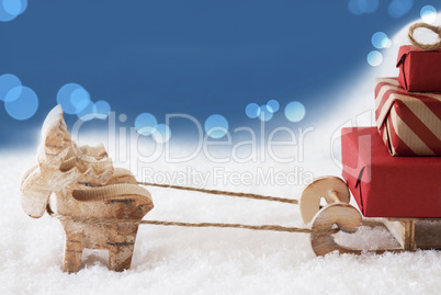 Reindeer With Sled, Blue Bokeh Background, Copy Space